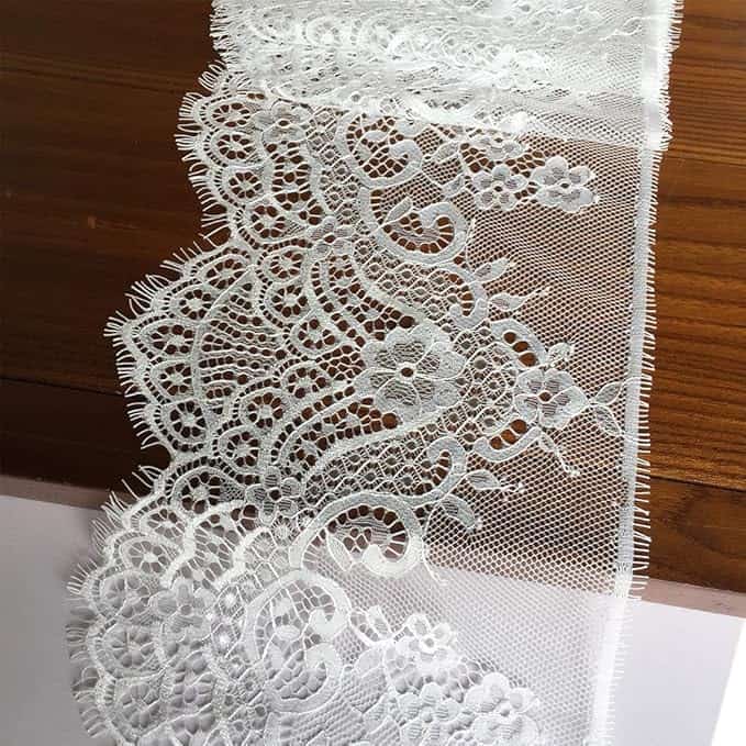 A CO2 laser flawlessly cutting a delicate lace pattern for a wedding dress