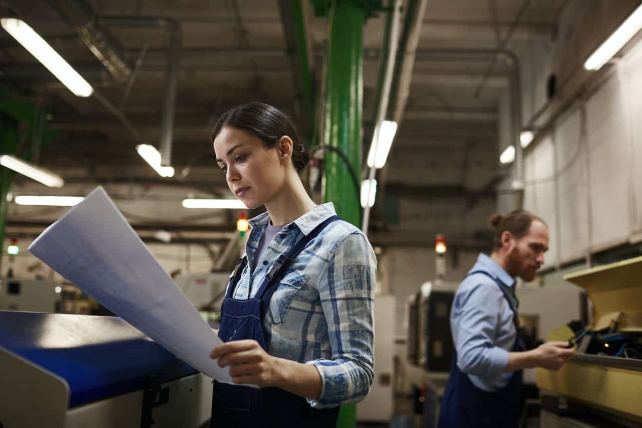 engineer with blueprint in the plant.jpg