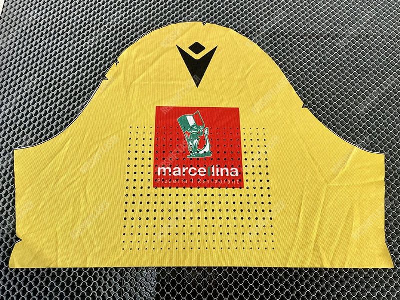 A thermal image showing heat escaping from the perforated zones of a sportswear shirt