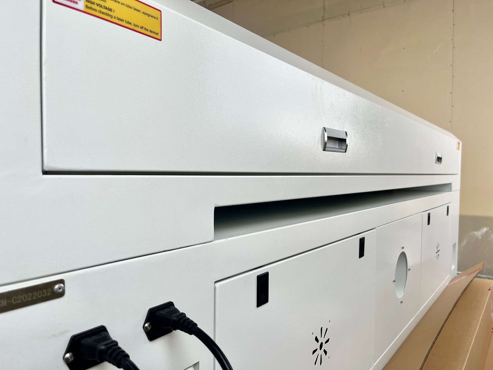 An image showcasing an advanced laser-cut felt product, like a foldable case using a living hinge or a multi-layered acoustic panel