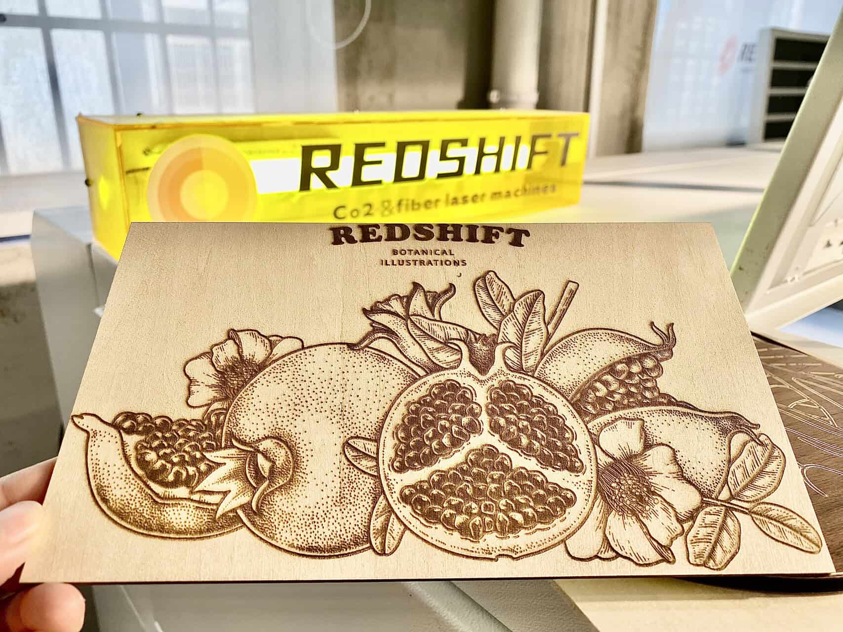 An image showing the same laser setting on two parts of a single pine board. One side is clean, the other is scorched due to a hidden resin pocket.