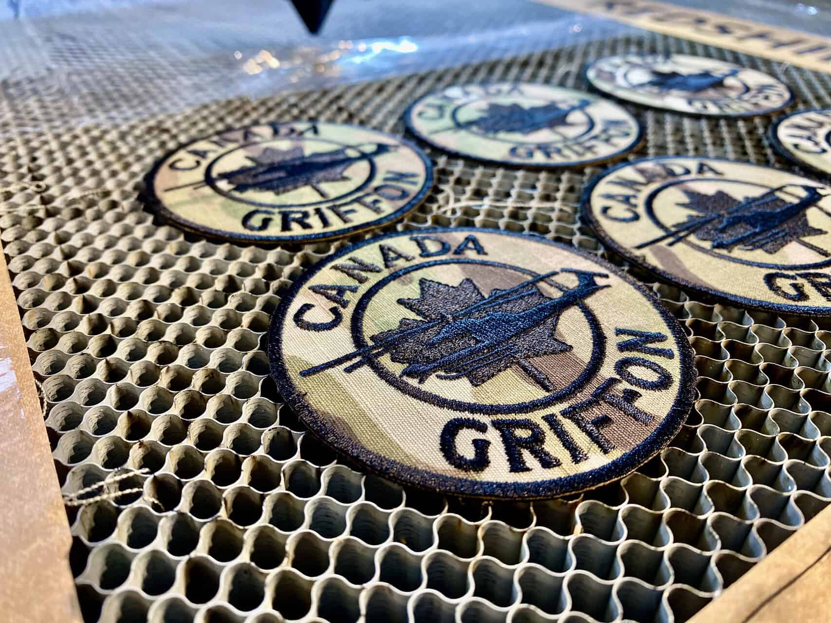 A diagram showing a laser beam focusing on a fabric, with arrows indicating vaporization and edge sealing