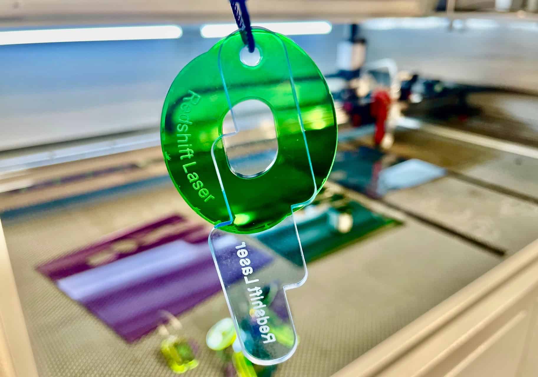 Professional Fume Extraction System for Laser Cutter A large, professional fume extraction unit connected with wide-bore tubing to a laser cutter