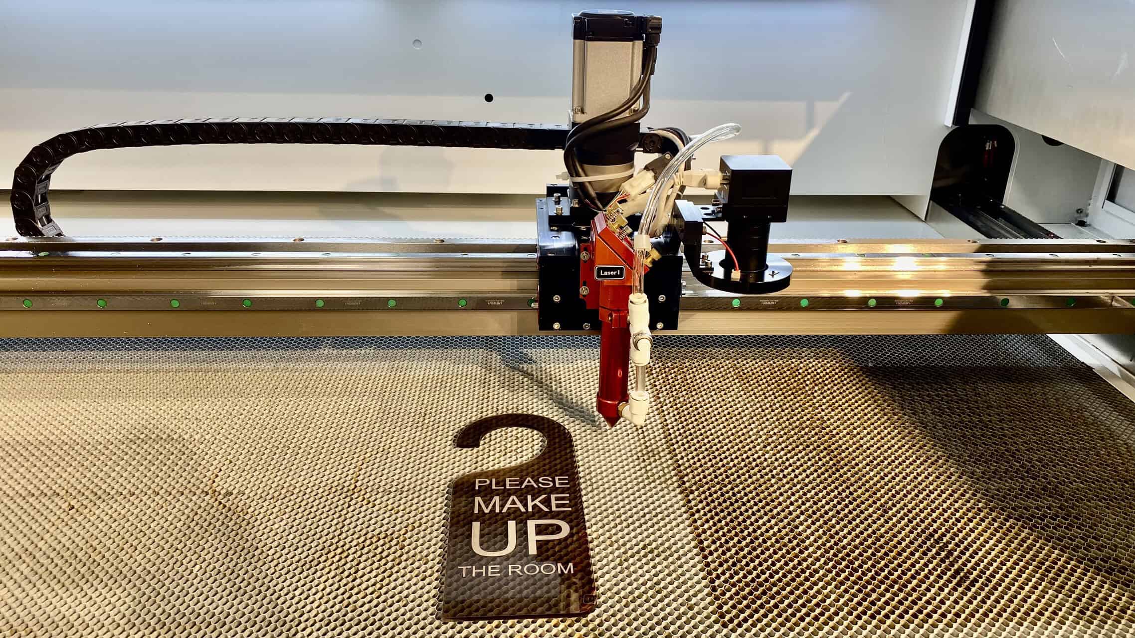 Thermoplastic vs. Thermoset Laser Cut Quality Side-by-side comparison of a clean laser-cut acrylic edge and a messy, charred edge of another plastic